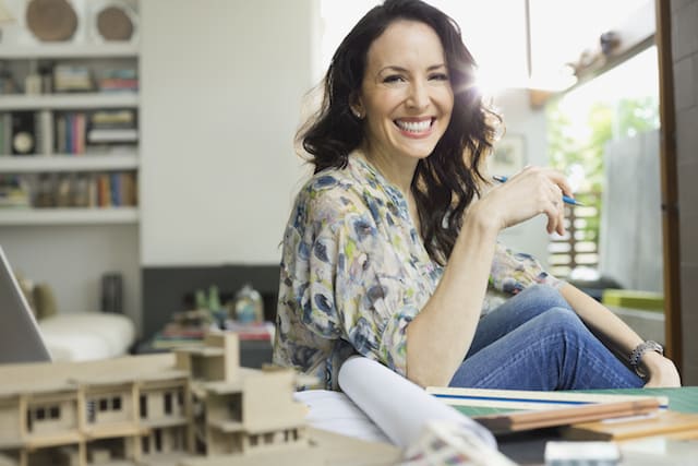 Woman smiling in a studio apartment