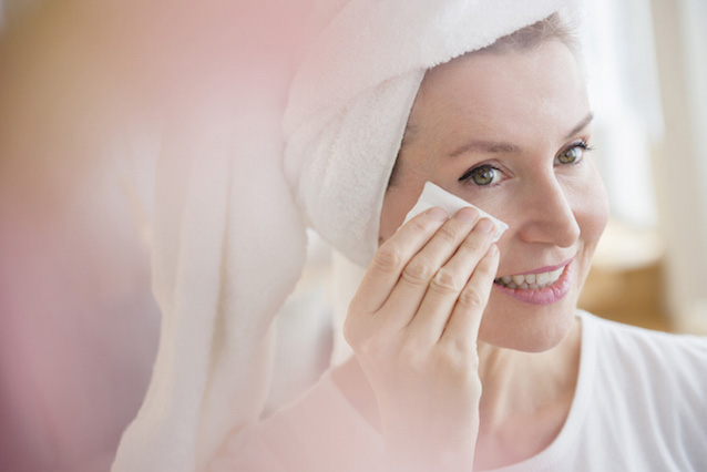 Woman applying NEUTROGENA® face toner